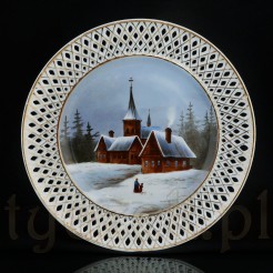 Dekoracyjny talerz z białej porcelany zdobiony złoceniem. 