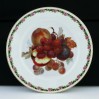Soczysta brzoskwinia wśród winogron – talerz deserowy Rosenthal