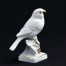 Figurka siedzącego ptaka z porcelany kolekcjonerskiej