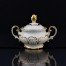 Niezwykle luksusowa cukierniczka z kremowej porcelany ociekająca złotem