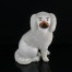 Urokliwy pies Staffordshire z bialej porcelany.