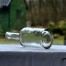Spód zabytkowej butelki z przezroczystego szkła