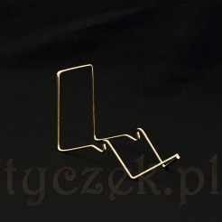 Luksusowy stojak w złotym kolorze na filiżankę ze spodkiem