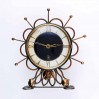 Zegar typu słoneczko marki Orfac ciekawa metaloplastyka