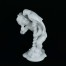 Figurka porcelanowa z putto i papugą na spiralnym stojaku