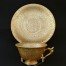 Porcelanowa filiżanka pokryta trawionym złotem