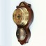 Elegancki zegar z mosiądzu na mahoniowej desce