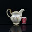 Elegancki mlecznik ze szlachetnej porcelany zdobiony licznymi złoceniami