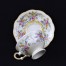 Filigranowa filiżanka do małej czarnej ustawiona została na niedużej stopce