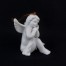Rozmarzony anioł - figurka porcelanowa