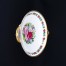Unikatowa paterka na stopce RS Tillowitz (Prussia) z lat 1910–1945, wykonana z białej porcelany, dekorowana ręcznie malowanymi kwiatami i złoceniami. Idealna do kolekcji.